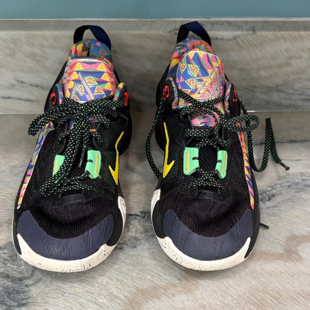 Nike Kids Black Sneakers with Neon Yellow Swoosh and Multicolor Pattern